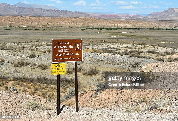 Sign shows the trail to St. Thomas, with the ghost town seen in the background, on August 3, 2015 in the Lake Mead National Recreation Area, Nevada....