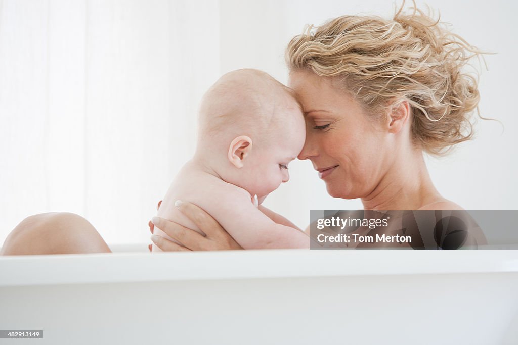 Mother and baby bathing