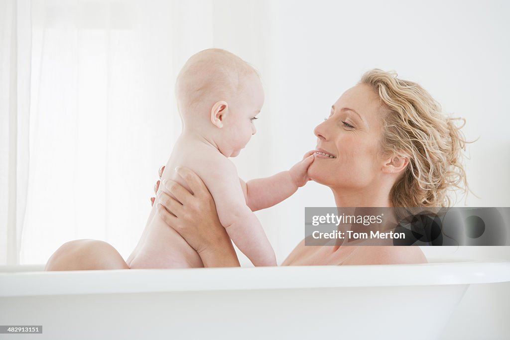 Mother and baby bathing