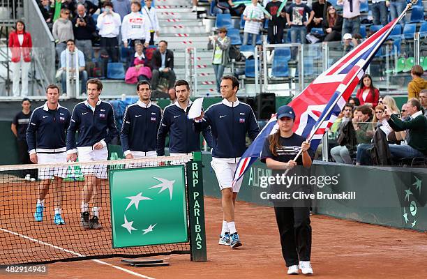 Ross Hutchins of Great Britain leads out his team mates prior to the opening ceremony and national anthems during day two of the Davis Cup World...