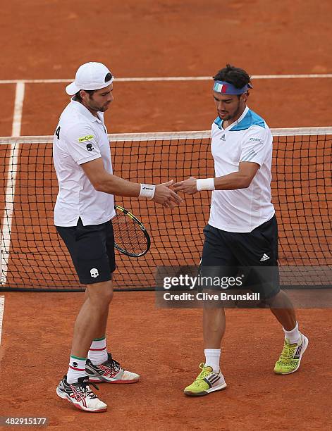 Simone Bolelli and Fabio Fognini of Italy show their dejection against Andy Murray and Colin Fleming of Great Britain during day two of the Davis Cup...