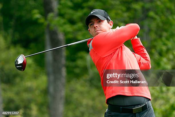 Rory McIlroy of Northern Ireland watches his tee shot on the thirteenth hole during round three of the Shell Houston Open at the Golf Club of Houston...