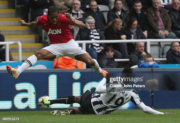 Antonio Valencia of Manchester United in action with Massadio Haidara of Newcastle United during the Barclays Premier League match between Newcastle...