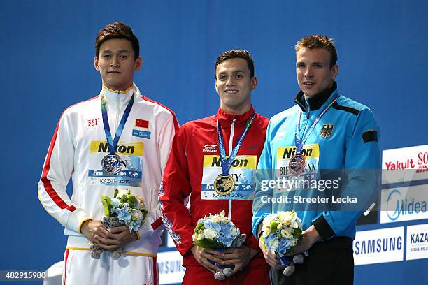 Gold medallist James Guy of Great Britain poses with silver medallist Yang Sun of China and bronze medallist Paul Biedermann of Germany during the...