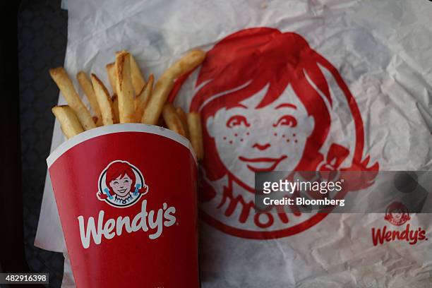 Wendy's Co. French fries are arranged for a photograph at a restaurant location in Mt. Vernon, Illinois, U.S., on Wednesday, July 29, 2015. Wendy's...