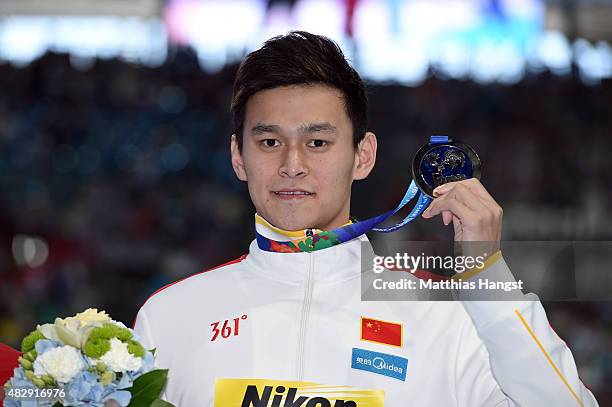 Silver medallist Yang Sun of China poses during the medal ceremony for the Men's 200m Freestyle Final on day eleven of the 16th FINA World...