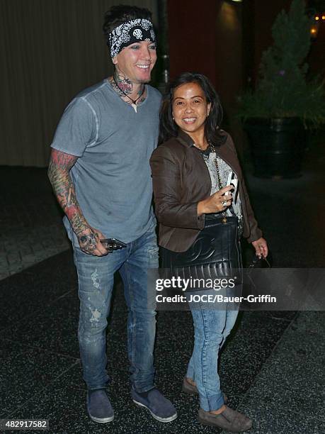 Ashba is seen taking pictures with a fan white leaving a restaurant on August 03, 2015 in Los Angeles, California.
