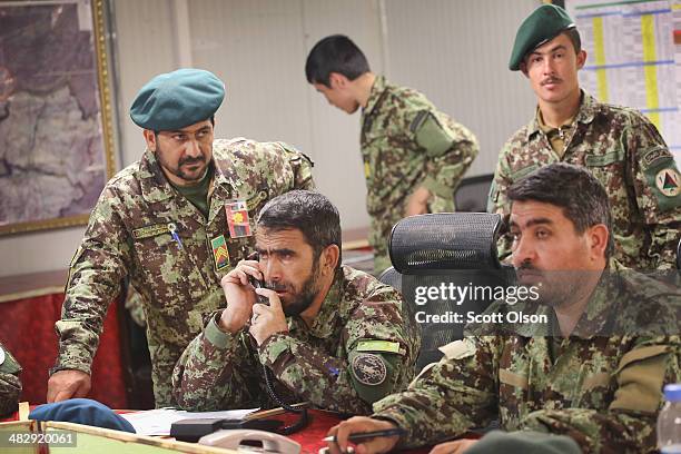 Soldier with the Afghan National Army direct security for the election from the tactical operations center at Camp Maiwand on April 5, 2014 near...