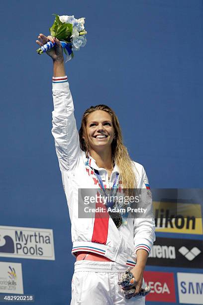 Gold medallist Yuliya Efimova of Russia celebrates during the medal ceremony for the Women's 100m Breaststroke Final on day eleven of the 16th FINA...