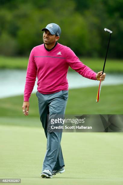 Sergio Garcia of Spain reacts to a missed putt on the green of the eighth hole during round three of the Shell Houston Open at the Golf Club of...