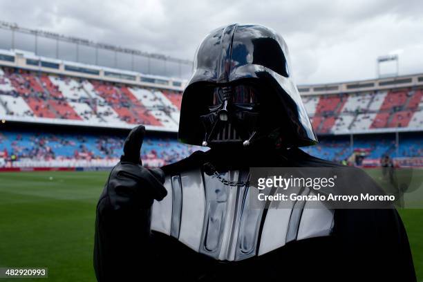 Man dressed up as Darth Vader of Stars War film walks on the pitch prior to start the La Liga match between Club Atletico de Madrid and Villarreal CF...
