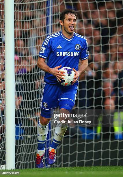 Frank Lampard of Chelsea celebrates scoring their second goal from the rebound of his penalty during the Barclays Premier League match between...