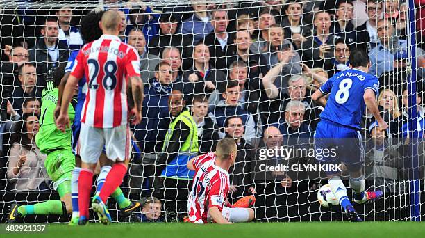 Chelsea's English midfielder Frank Lampard is first to the loose ball to score Chelsea's second goal from the rebound after Stoke City's Bosnian...