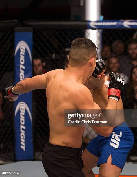 Hayder Hassan punches Vicente Luque during the filming of The Ultimate Fighter: American Top Team vs Blackzilians on February 27, 2015 in Coconut...