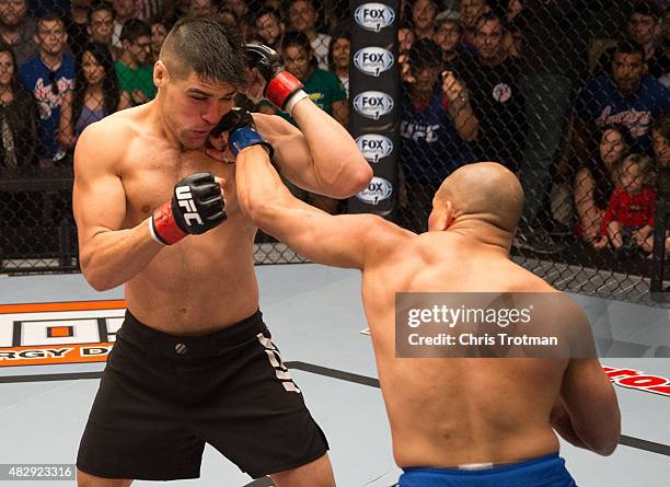 Hayder Hassan punches Vicente Luque during the filming of The Ultimate Fighter: American Top Team vs Blackzilians on February 27, 2015 in Coconut...