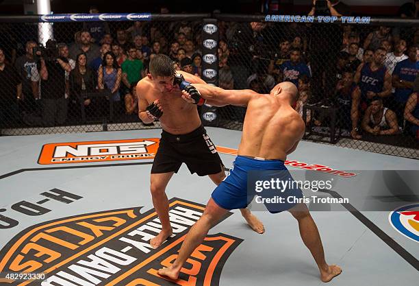 Hayder Hassan punches Vicente Luque during the filming of The Ultimate Fighter: American Top Team vs Blackzilians on February 27, 2015 in Coconut...