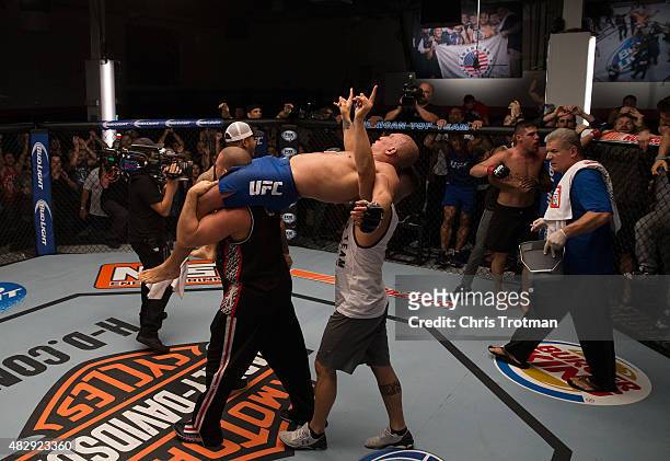 Hayder Hassan raises his hands as he waits for the judges decision after his fight against Vicente Luque during the filming of The Ultimate Fighter:...