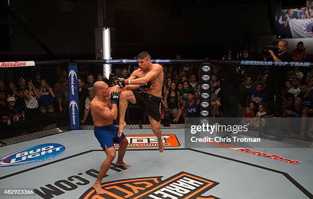 Vicente Luque knees Hayder Hassan during the filming of The Ultimate Fighter: American Top Team vs Blackzilians on February 27, 2015 in Coconut...