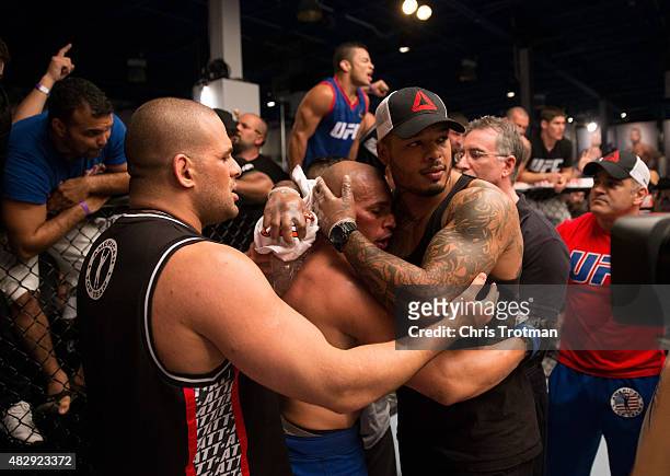 Hayder Hassan hugs teammates after his bout against Vicente Luque during the filming of The Ultimate Fighter: American Top Team vs Blackzilians on...