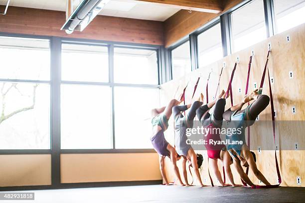 group wall yoga class - strap stock pictures, royalty-free photos & images