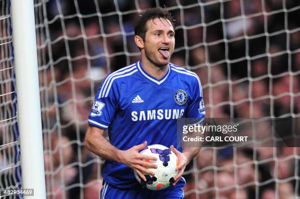 Chelsea's English midfielder Frank Lampard celebrates after scoring Chelsea's second goal from the rebound after Stoke City's Bosnian goalkeeper...