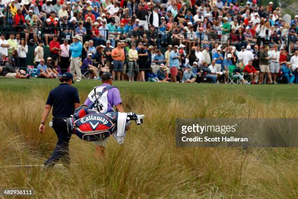 Phil Mickelson of the United States walks to the green of the sixteenth hole during round three of the Shell Houston Open at the Golf Club of Houston...