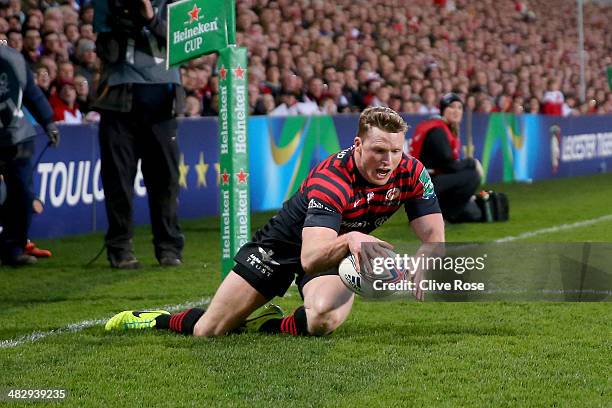 Chris Ashton of Saracens dives over to score a try during the Heineken Cup Quarter-Final match between Ulster and Saracens at Ravenhill on April 5,...