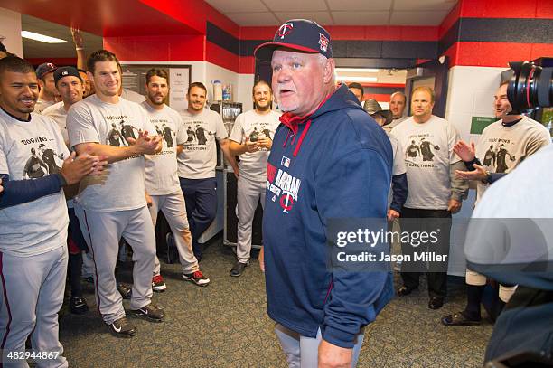 Ron Gardenhire of the Minnesota Twins talks with his players in the visitors dugout at Progressive Field after the Twins defeated the Cleveland...