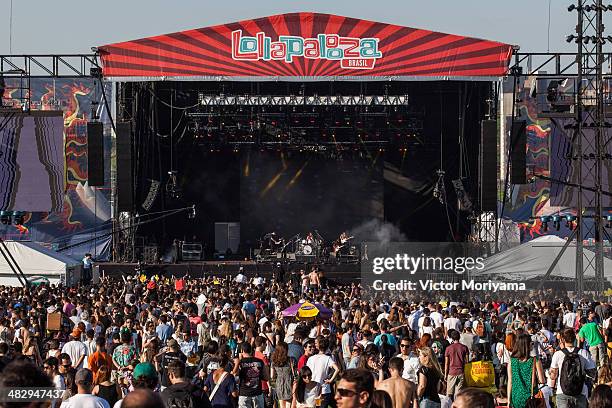 Music fans watch Julian Casablancas perform as part of Julian Casablancas and the Voidz during 2014 Lollapalooza Brazil at Autodromo de Interlagos on...