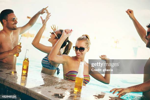 friends having fun at beach bar. - local bar stock pictures, royalty-free photos & images