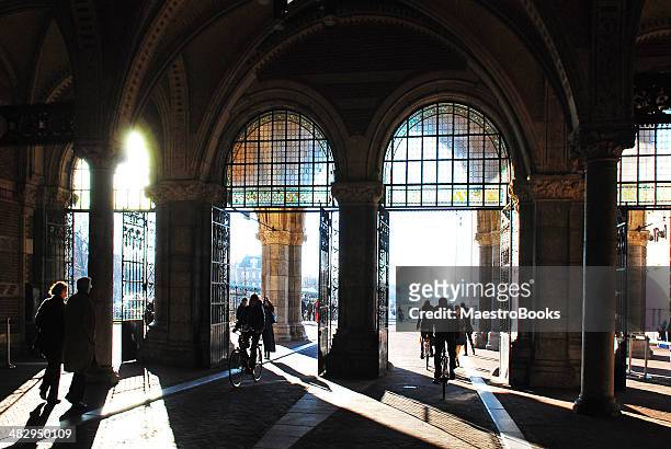 bicycle pass and tunnel of the rijksmuseum - rijksmuseum amsterdam stock pictures, royalty-free photos & images