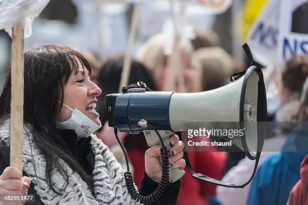 striking nsgeu nurse with megaphone - picket line stock pictures, royalty-free photos & images