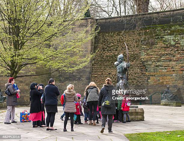 visiting the robin hood statue in nottingham - nottingham uk stock pictures, royalty-free photos & images