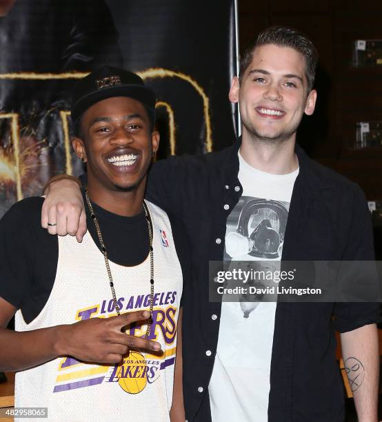 Recording artists Malcolm David Kelley and Tony Oller of MKTO sign copies of their debut album "MKTO" at Barnes & Noble bookstore at The Grove on...