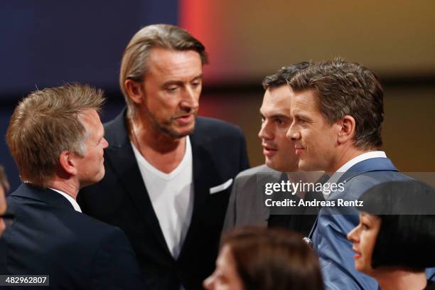 Host Markus Lanz speaks with ZDF program director Norbert Himmler and other team members after the 'Wetten, dass..?' tv show on April 5, 2014 in...