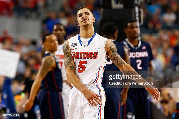 Scottie Wilbekin of the Florida Gators reacts against the Connecticut Huskies during the NCAA Men's Final Four Semifinal at AT&T Stadium on April 5,...