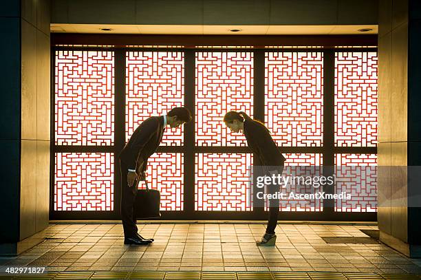 asian business - woman bowing stock pictures, royalty-free photos & images