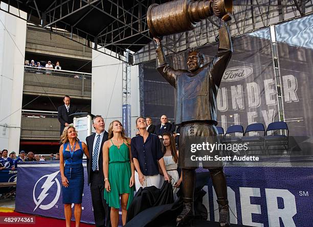 Dave Andreychuk's daughters unveil his bronze statue outside of the Tampa Bay Times Forum before the start of the game between the Tampa Bay...