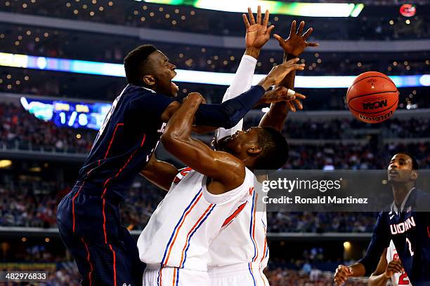 Amida Brimah of the Connecticut Huskies goes to the basket as Will Yeguete of the Florida Gators defends during the NCAA Men's Final Four Semifinal...