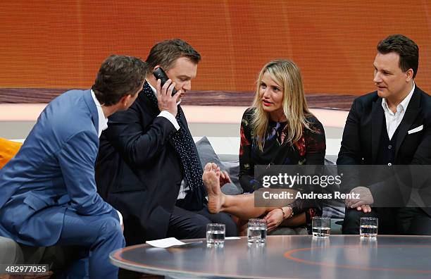 Host Markus Lanz, Hape Kerkeling, Cameron Diaz and Guido Maria Kretschmer talk on stage during the 'Wetten, dass..?' tv show on April 5, 2014 in...