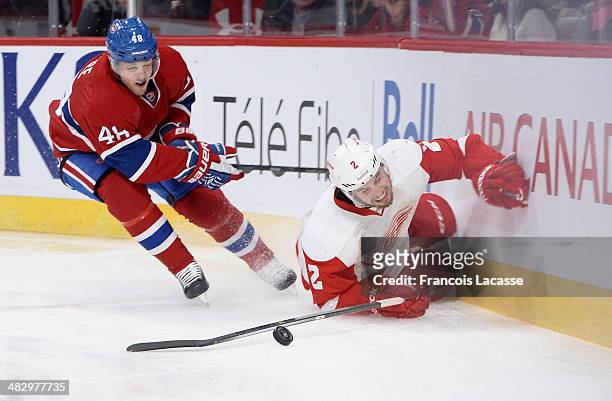 Daniel Briere of the Montreal Canadiens fights for the puck against Brendan Smith of the Detroit Red Wings during the NHL game on April 5, 2014 at...