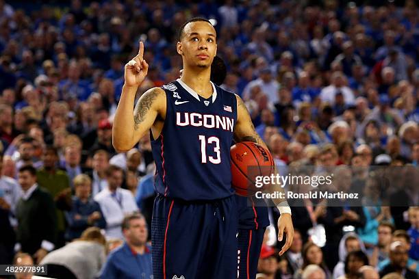 Shabazz Napier of the Connecticut Huskies celebrates during the NCAA Men's Final Four Semifinal against the Florida Gators at AT&T Stadium on April...