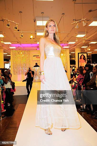 Model walks runway in prom wear during Mack Wilds visit at Macy's Herald Square on April 5, 2014 in New York City.