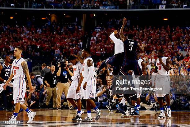 Terrence Samuel and the Connecticut Huskies celebrate after defeating the Florida Gators 63-53 in the NCAA Men's Final Four Semifinal at AT&T Stadium...