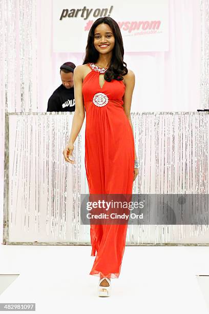 Model walks the runway during a prom themed fashion show at Macy's Herald Square on April 5, 2014 in New York City.