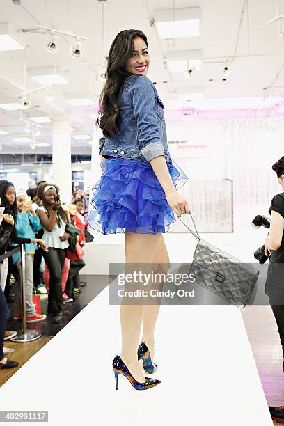 Model walks the runway during a prom themed fashion show at Macy's Herald Square on April 5, 2014 in New York City.