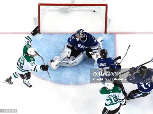 Colton Sceviour of the Dallas Stars celebrates the goal of teammate Vernon Fiddler against goalie Ben Bishop of the Tampa Bay Lightning during the...