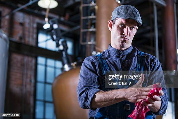 man working in old distillery - rubbing hands together stock pictures, royalty-free photos & images