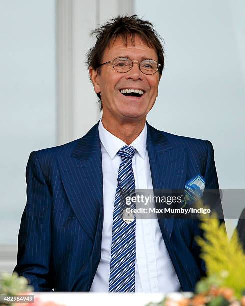 Sir Cliff Richard attends the Crabbie's Grand National horse racing meet at Aintree Racecourse on April 5, 2014 in Liverpool, England.