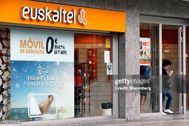Customer exits a Euskaltel SA phone store in Barakaldo, Spain, on Tuesday, Aug. 4., 2015. Euskaltel, the phone and broadband carrier that operates in...